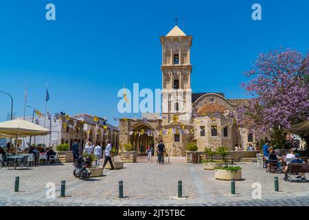 Larnaca, Cyprus - April 22, 2022 - candid street photography of people at St. Lazarus Church in summer under blue sky Stock Photo