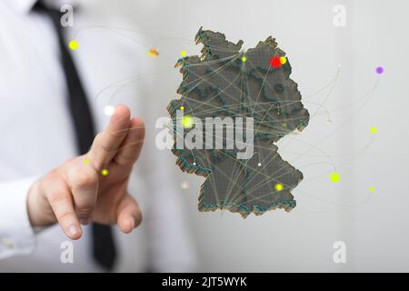 A 3D rendered German map hovering in man's hand Stock Photo