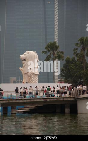 The Merlion, Singapore River, Singapore.  Half-lion and half fish, the merlion is one of Singapore's icons and stands overlooking the Singapore River. Stock Photo