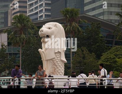 The Merlion, Singapore River, Singapore.  Half-lion and half fish, the merlion is one of Singapore's icons and stands overlooking the Singapore River. Stock Photo