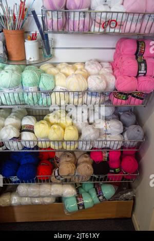 Aldeburgh, Suffolk, England,August 26th 2022,  Wool for sale in a charity shop Stock Photo