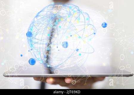 A businessman holding global network lines on a tablet- networking concept Stock Photo