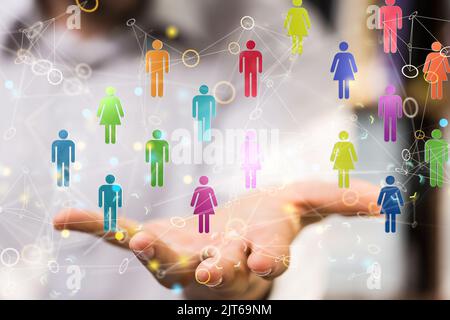 A female holds colorful people icons in hand- digital network and data concept Stock Photo