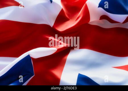 A closeup shot of deep tones of the ruffled flag of the United Kingdom Stock Photo