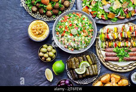 Arabic cuisine; Middle Eastern traditional dishes.  Top view with close up. Halal food concept. Stock Photo