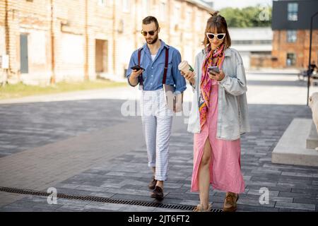 Young hipsters hang out together near office outdoors Stock Photo