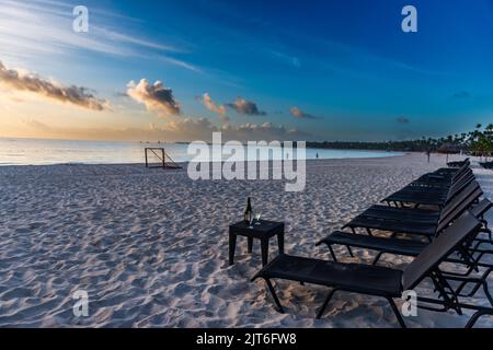 Wine and beach chairs on Playa Bavaro in Punta Cana in the Dominican Republic. Stock Photo