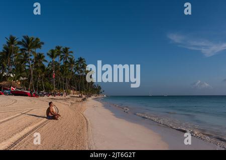 Punta Cana/ Dominican Republic - June 12 2016: Man meditates on beach shore. Stock Photo