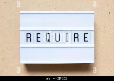Lightbox with word require on wood background Stock Photo