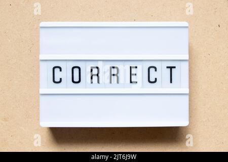 Lightbox with word correct on wood background Stock Photo