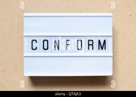 Lightbox with word conform on wood background Stock Photo