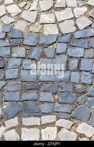 cobblestone pavement of old town texture background autumn, Top view. stone road or granite sidewalk. Old street cobblestones for backdrop. Abstract v Stock Photo