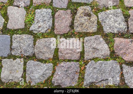 cobblestone pavement of old town texture background autumn, Top view. stone road or granite sidewalk. Old street cobblestones for backdrop. Abstract v Stock Photo