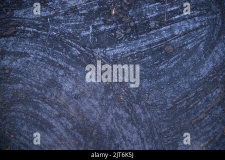 Old metal surface covered black ash  abstract background texture Stock Photo