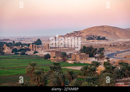 Landscape of Valley of The Kings in the morning at Theban Necropolis with The Temple of Ramesseum for Pharaoh Ramses II and the green crop of the vill Stock Photo