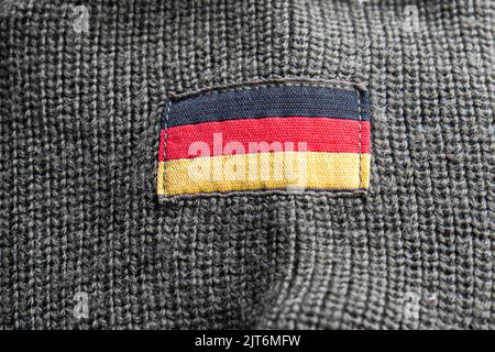 28 August 2022: German flag on army uniform Stock Photo