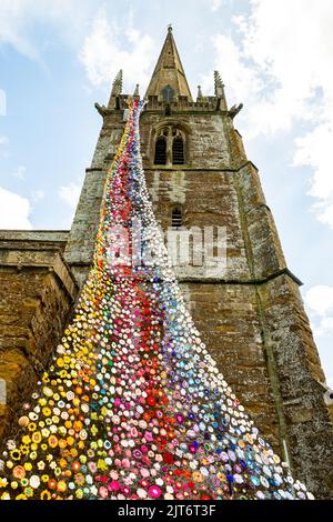The north tower of All Saints church in Middleton Cheney decorated with crochet flower and animals Stock Photo