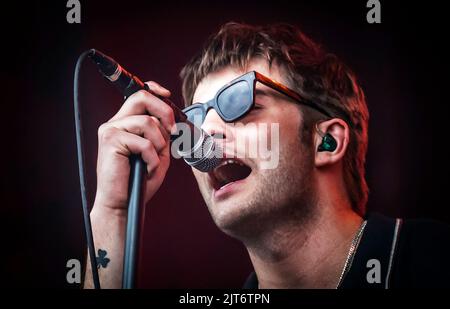 Grian Chatten performs with his band Dontaines D.C. during the Leeds Festival 2022 at Bramham Park in Leeds. Picture date: Sunday August 28, 2022. Stock Photo