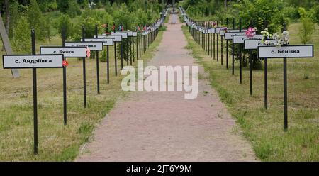 Signs in memory of the various towns and villages that disappeared consecutively to the Chernobyl disaster. Chernobyl exclusion zone, Ukraine Stock Photo