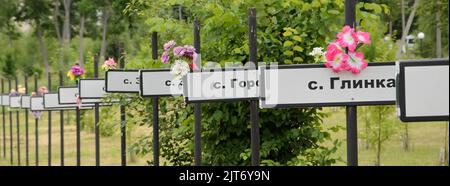 Signs in memory of the various towns and villages that disappeared consecutively to the Chernobyl disaster. Chernobyl exclusion zone, Ukraine Stock Photo