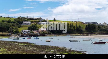 Clonakilty, Ireland, July 2, 2022. The sunny coast of Ireland. Small fishing boats are anchored in Clonakilty Bay at low tide. Picturesque seascape. E Stock Photo