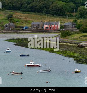 Clonakilty, Ireland, July 2, 2022. Several small boats are anchored in Clonakilty Bay at low tide. Shallow sea water. Coastal Irish landscape. Stock Photo