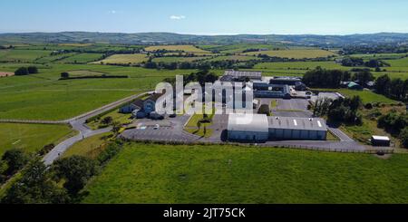 West Cork, Ireland, July 9, 2022. Clonakilty Agricultural College among green fields on a sunny summer day, buildings on green grass field, top view. Stock Photo