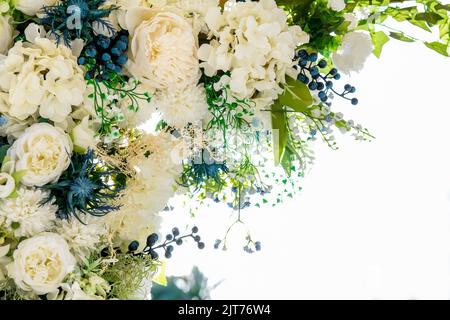 Handmade bouquets, wedding Collection White boutonnieres, corsages, Wedding Arch, rose petals, Flower Frame With Copy Space. Stock Photo