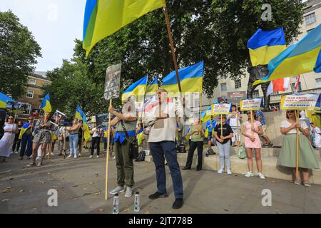 London, UK. 28th Aug, 2022. Ukrainians and those who sympathise with the cause protest against the war and for increased military and other support opposite Downing Street in London today, following Ukraine's Independence Day last week. The rally concludes with participants singing the Ukrainian National anthem. Credit: Imageplotter/Alamy Live News Stock Photo