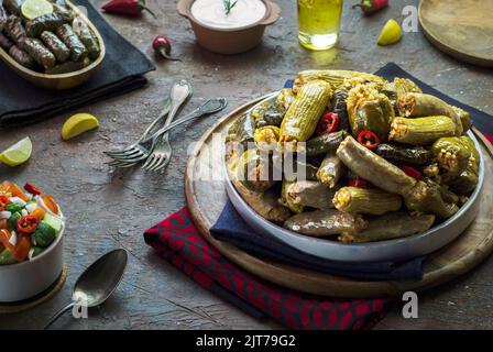 Arabic cuisine; Egyptian traditional dish 'Mahshy' or 'Dolma'. Stuffed Zucchini, eggplant, tomato, peppers and vine leaves. Stock Photo