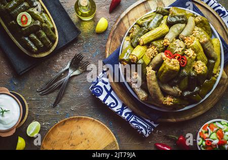 Arabic cuisine; Egyptian traditional dish 'Mahshy' or 'Dolma'. Stuffed Zucchini, eggplant, tomato, peppers and vine leaves. Stock Photo