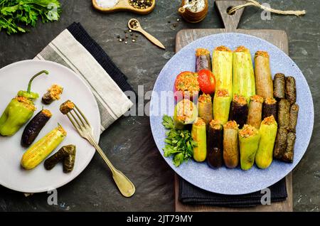 Arabic cuisine; Egyptian traditional dish 'Mahshy' or 'Dolma'. Stuffed Zucchini, eggplant, tomato, peppers and vine leaves. Stock Photo