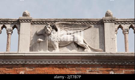 Emblem of Venice, St Mark represented by a winged lion; above Teatro Italia, Venice, Italy Stock Photo