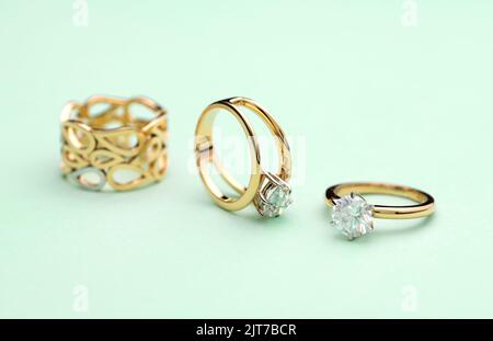Gold Engagement Diamond Ring on Tiffany Color Background Stock Photo