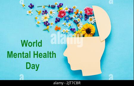 World Mental Health Day. Green ribbon on white wooden background, top view  with space for text Stock Photo - Alamy