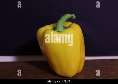 A paprika pepper photographed on a black background Stock Photo