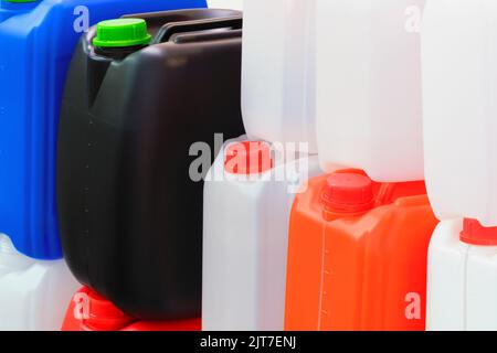 Multicolored plastic jerry can containers Stock Photo