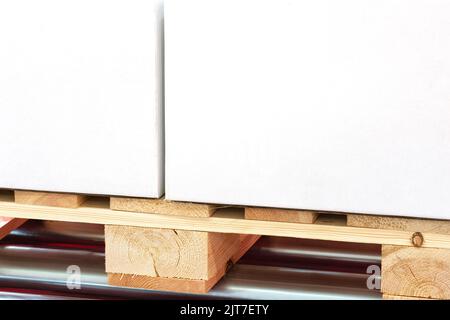 White cardboard boxes on euro pallet with copy space Stock Photo