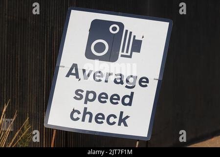 Average speed check sign located at the side of a slip road of the M621 in Leeds, during major roadworks Stock Photo