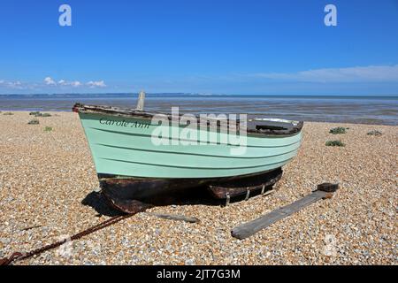 Carole Ann green fishing boat on the shingle beach at Dungeness Kent UK Stock Photo