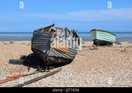 Carole Ann green fishing boat on the shingle beach at Dungeness Kent UK Stock Photo