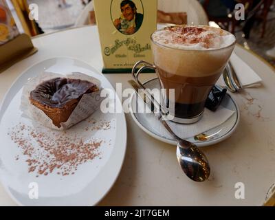 Coffee and Cake at of A Brasileira elegant coffee shop in the Chiado neighbourhood of central Lisbon. Stock Photo