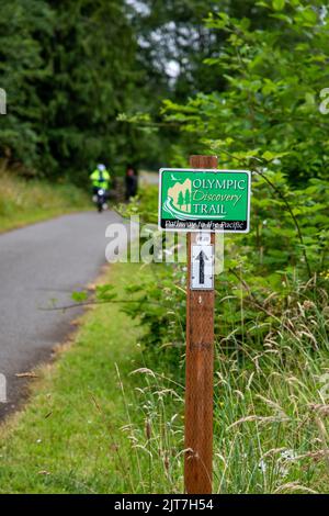 Sequim, WA USA - 07-18-2022: Olympic Discovery Trail with bicycle rider in soft focus in distance Stock Photo