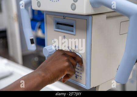 A radiologist using an xray machine Stock Photo