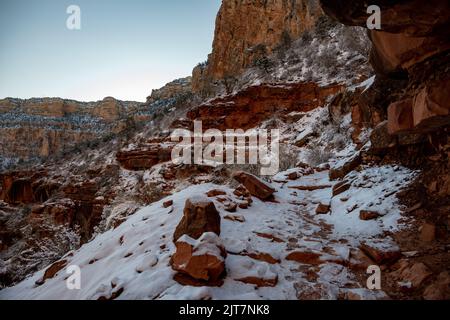 Red Rocks Frosted In Snow Along Bright Angel Trail in Grand Canyon National Park Stock Photo