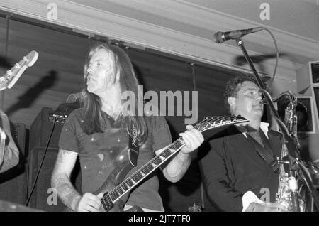 Guitarist Gregg Allman and saxophonist Raf Ravenscroft performing at the Hard Rock Cafe, London, UK in June 1991. Stock Photo