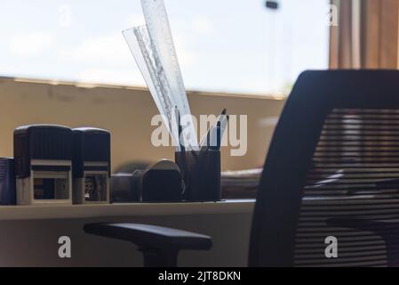 Swivel chair in office environment. Selective focus. Workplace. Empty office. Administrative office. I work on the pandemic. Empty professional office Stock Photo