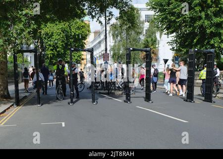 London, UK, 28th August, 2022. Knife arches are seen at the entrance to the Notting Hill Carnival as it made a returns to London after a three year hiatus caused by the Covid pandemic with Children's Day  - also known as Family Day.  An estimated two million are expected to visit the area during the bank holiday weekend. As well as the vibrant parades taking place - stages, soundsystems, Carribean food and drink stalls, are dotted along the route.  Credit: Eleventh Hour Photography/Alamy Live News Stock Photo