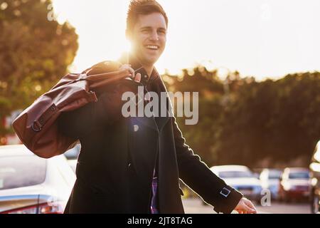 Hes a man about town. Portrait of a handsome young man taking a walk through the city. Stock Photo