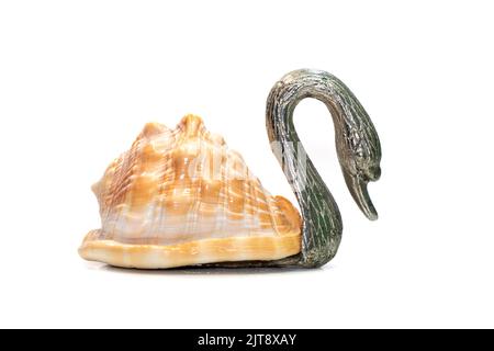 Image of swan sculpture with shells as part of its body. isolated on white background. Home decoration Stock Photo